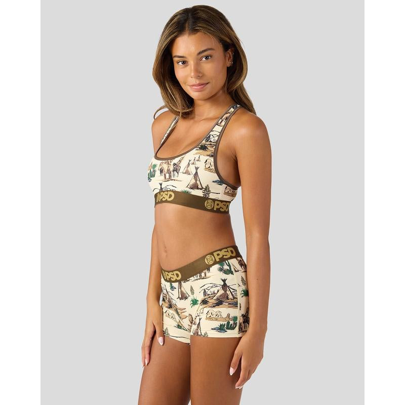 Vintage Racerback Sports Bra for Women worn by model, featuring Comanche print and lightweight fabric for comfort.